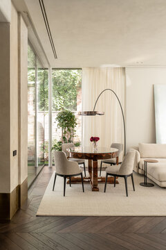 Bright living room with large window and greenery