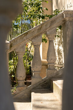 Architectural stair detail framed by greenery
