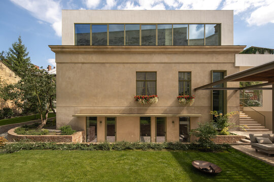 Modern house facade with landscaped yard