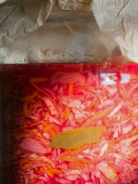 Sauerkraut fermenting in glass jar 