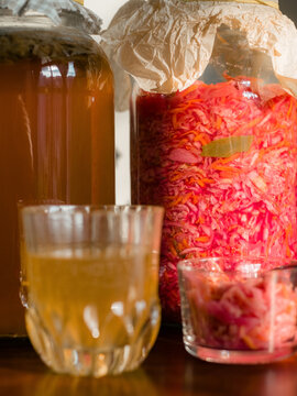 Sauerkraut and Kombucha on wooden table 