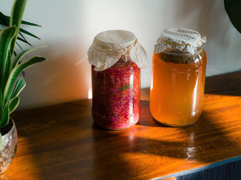 Sauerkraut and Kombucha in Jars at Home
