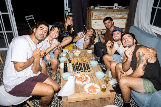 UGC Friends having homemade sushi dinner at home with direct flash