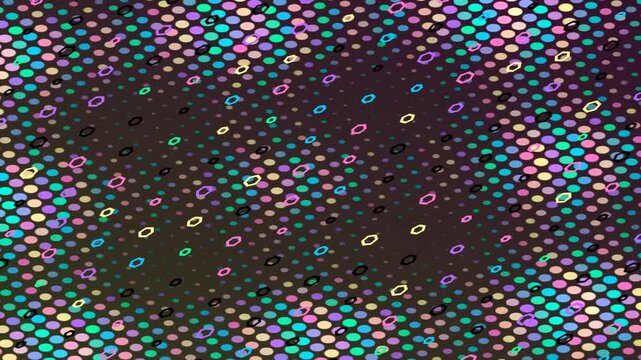 Close up view of a silicon wafer with colorful dies arranged in a grid pattern