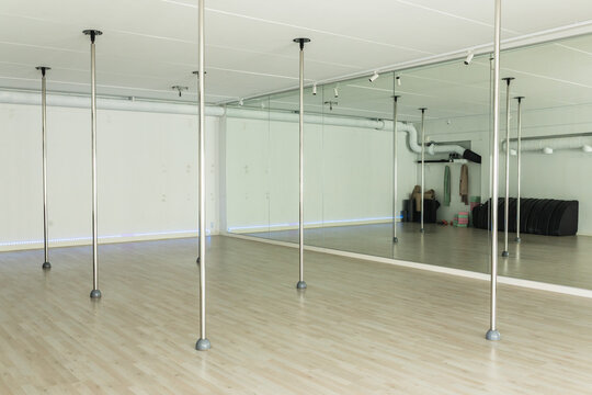 Modern empty pole dance studio interior