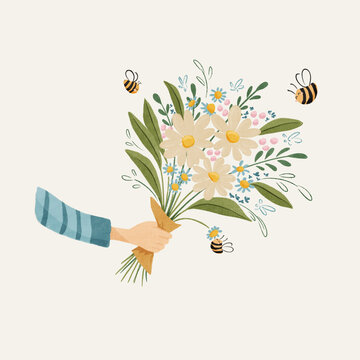 Hand holding a large bouquet of flowers with bees