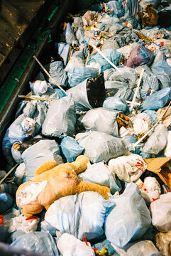 Trash bags in dumpster at dump transfer station film