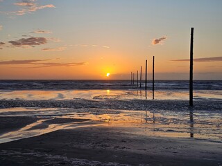 Scenic sunset over the Wadden Sea. Sankt Peter-Ording, North Sea © izmir