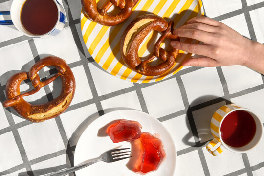 Picnic with Snacks and Drinks at a Table With Pretzels and Jelly