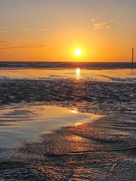 Scenic sunset over the Wadden Sea. Sankt Peter-Ording, North Sea