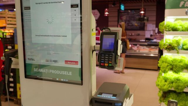 Customer Tapping Bank Card on Contactless Payment Terminal
