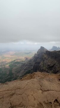 Wide angle shot of Konkankada during the pre-monsoon season at Harishchandragad, Maharashtra