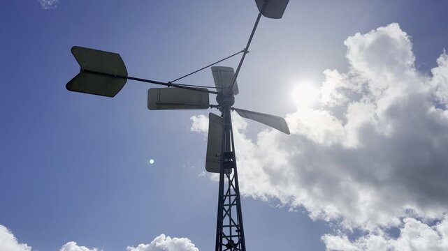 Spinning metal agricultural wind pump silhouette 4K
