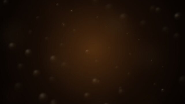 Abstract dark brown spheres floating in warm glowing liquid