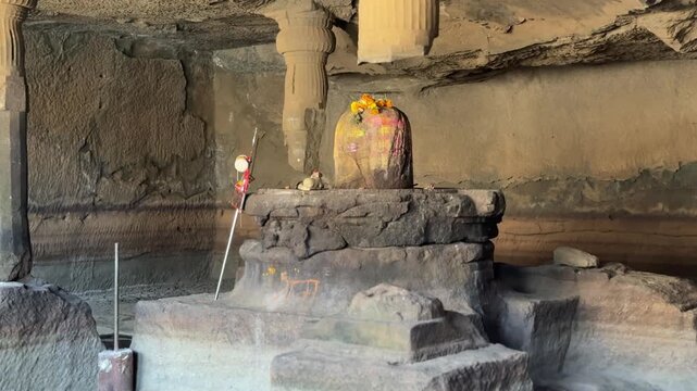 Closeup shot of Shivling at Harishchandragad inside a rock cave in Maharashtra. 4k.