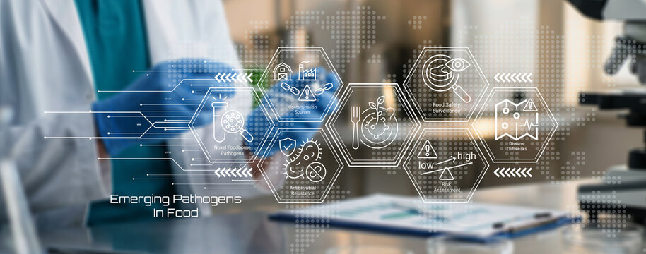 Scientist analyzing emerging pathogens detection methods in food safety research laboratory setting