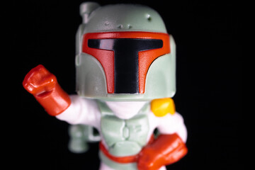 Naklejka premium Kinder Surprise Lucasfilm Boba Fett face on the black background
