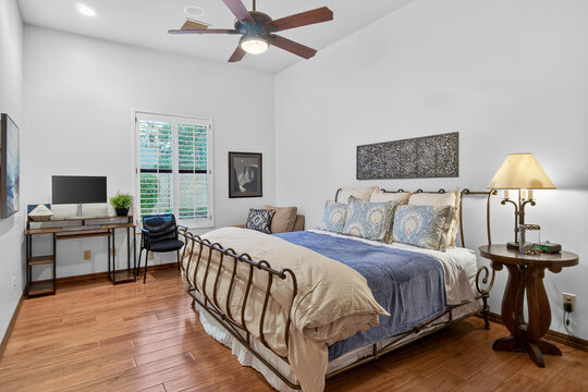 Cozy bedroom with queen bed and workspace