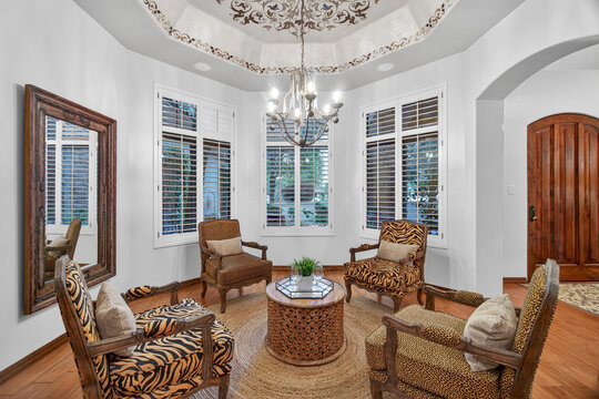Living room with circular seating and chandelier