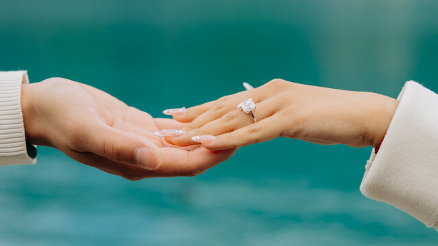close up of a man holding his hands