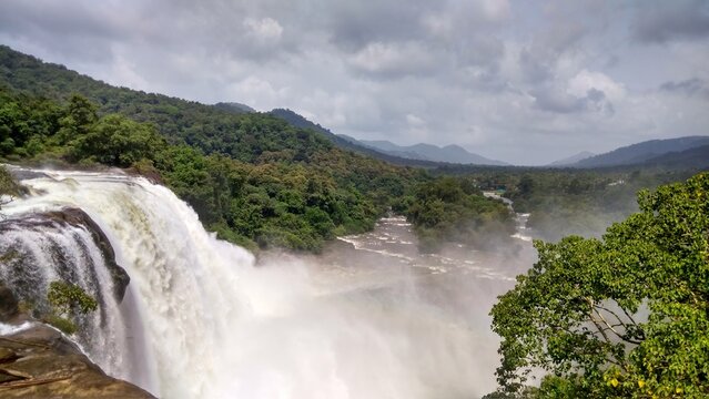 Athirappilly, Thrissur, Kerala, India, 29-july-2018: Athirappilly Falls, often called the "Niagara of India," is a majestic 80 foot tall waterfall on Chalakudy River 