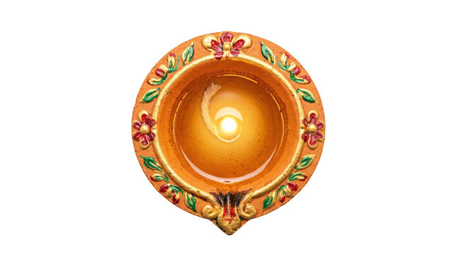 Lit diya oil lamp with decorations isolated on transparent background