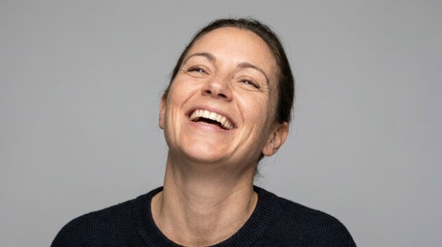 Joyful Woman Laughing with Eyes Closed