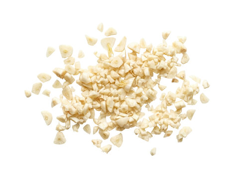 Pile of finely chopped fresh garlic cloves on a white background