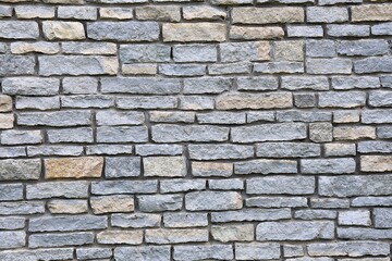 Fototapeta premium Gray stone wall pattern with detailed masonry texture