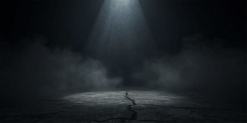 Single bright spotlight shining down on cracked dark ground with dramatic smoke and fog effect © Abdul