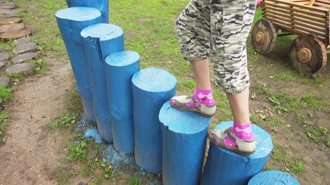 Beautiful little girl playing on playground