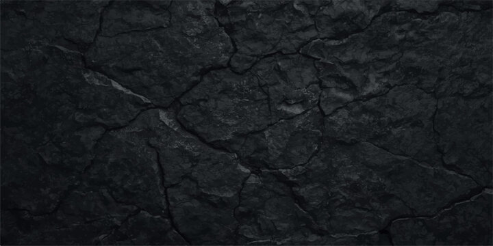 Black cracked stone background with deep fissures and rough textured charcoal rock surface