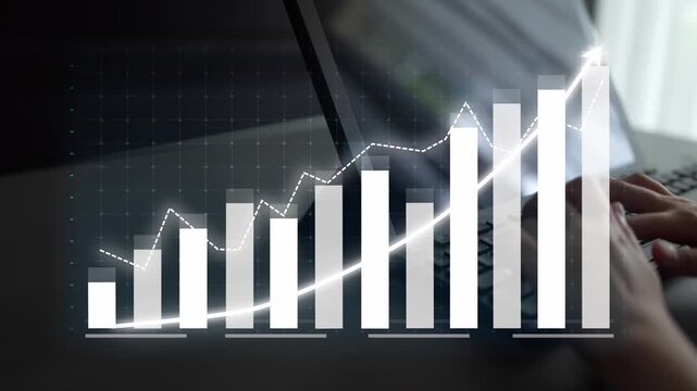 A hands-on view of data visualization showcasing a growth trend graph on a laptop screen in a modern office, symbolizing business progress and performance analysis. Copula