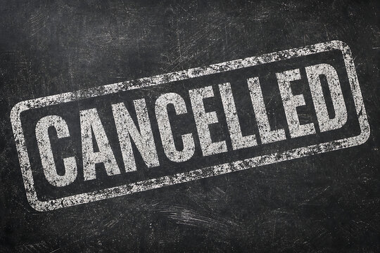 Cancelled Stamp Imprint on Dark Textured Background with Grunge Effect