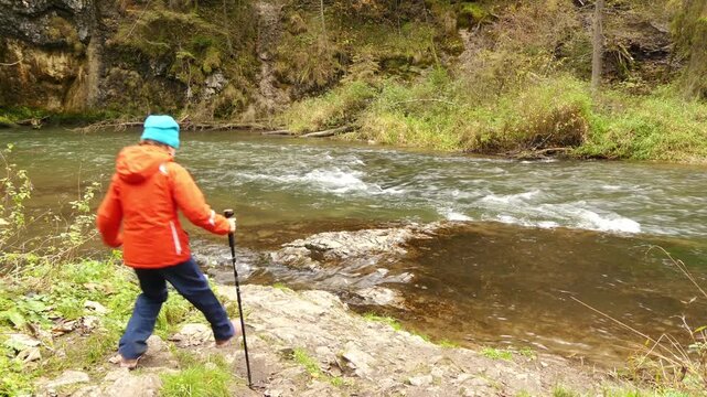 Little beautiful girl walks in Slovak Paradise. Slovak Paradise (Slovensky raj) is mountain range in eastern Slovakia, part of Spis-Gemer Karst, located between towns of Spisska Nova Ves and Dobsina.
