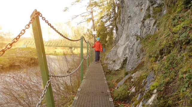 Little beautiful girl walks in Slovak Paradise. Slovak Paradise (Slovensky raj) is mountain range in eastern Slovakia, part of Spis-Gemer Karst, located between towns of Spisska Nova Ves and Dobsina.
