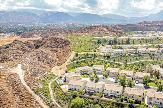 Santa Clarita, California CA September 16, 2024: High Aerial City Drone View toward English Ivy Ln, Humphreys, Lost Canyon Rd, Medley Ridge Dr with Townhouses, Homes, Houses, Community, Streets, Roads