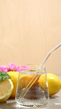 Air bubbles in a water machine, a concept of pure water enriched with vitamins, lemon