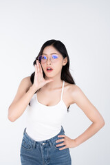 Fototapeta premium Happy young asian woman wearing glasses and casual with surprised or wow and shocked face expression isolated on white background. 