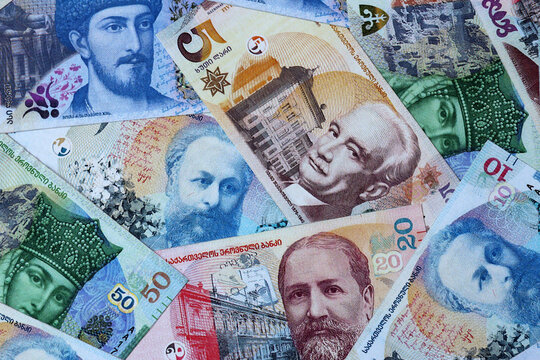 Georgian lari money bills in pile on table. Georgia GEL currency cash close up