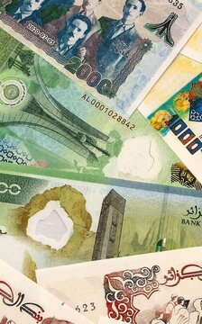 Algerian dinar money bills in pile on table. Algeria DZD currency cash close up