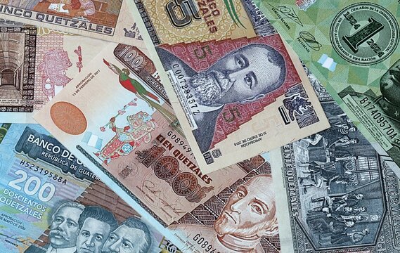 Guatemalan quetzal money bills in pile. Big amount of Guatemala GTQ currency cash close up