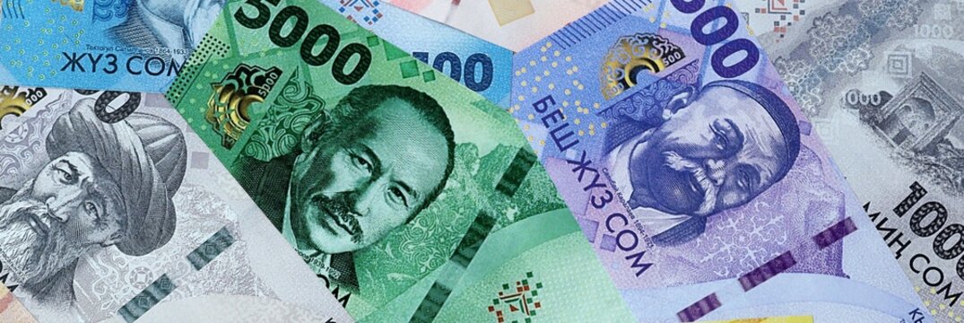 Kyrgyzstani som money bills in pile. Big amount of Kyrgyzstan KGS currency cash close up