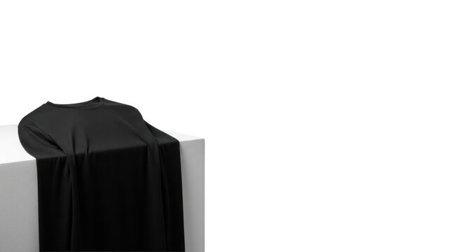A premium black long-sleeved t-shirt, folded, showcasing subtle fabric texture on a light grey surface against a transparent studio background with copy space. Concept of minimalist product