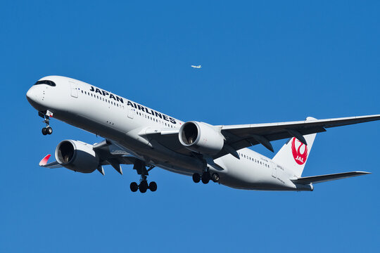 Japan Airlines Airbus A350-900 (JA10XJ) passenger plane on final approach to Haneda Airport under clear blue sky