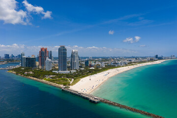 Obraz premium Miami cityscape with luxury skyscrapers and ocean. Panoramic drone view of Miami coastline. Miami Beach from above. Miami skyline from top.
