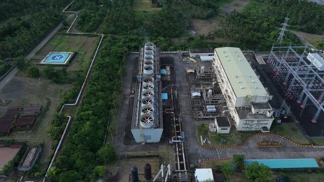 Aerial overhead view captures geothermal power plant multiple structures, Tabaco City, Philippines.Ideal for educational & corporate videos.