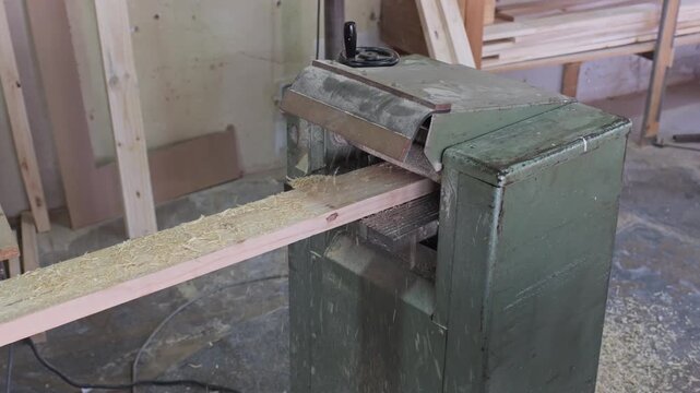 Timber going through a thickness planer