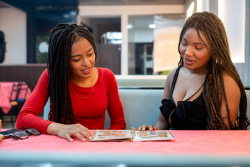 Fototapeta premium Diverse friends consulting menu enjoying restaurant leisure time