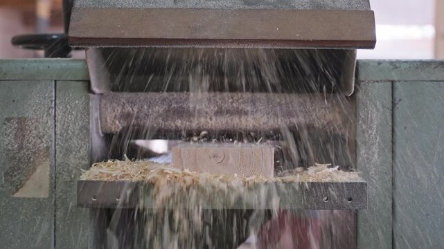 Timber going through a thickness planer